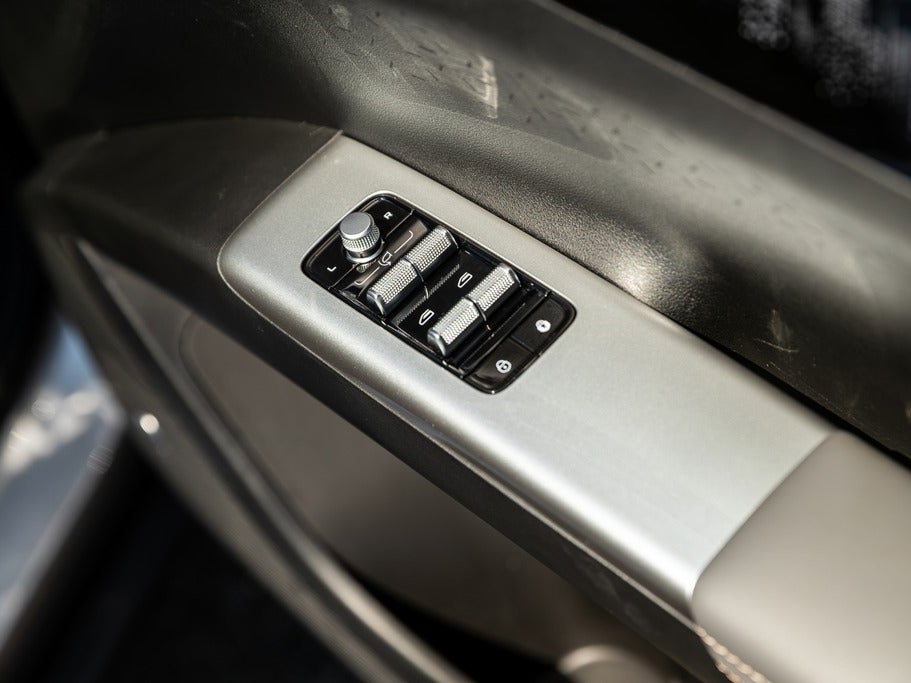 There's a strange mix of materials inside the Geely EX2 including these retro looking window and mirror controls (Geely)