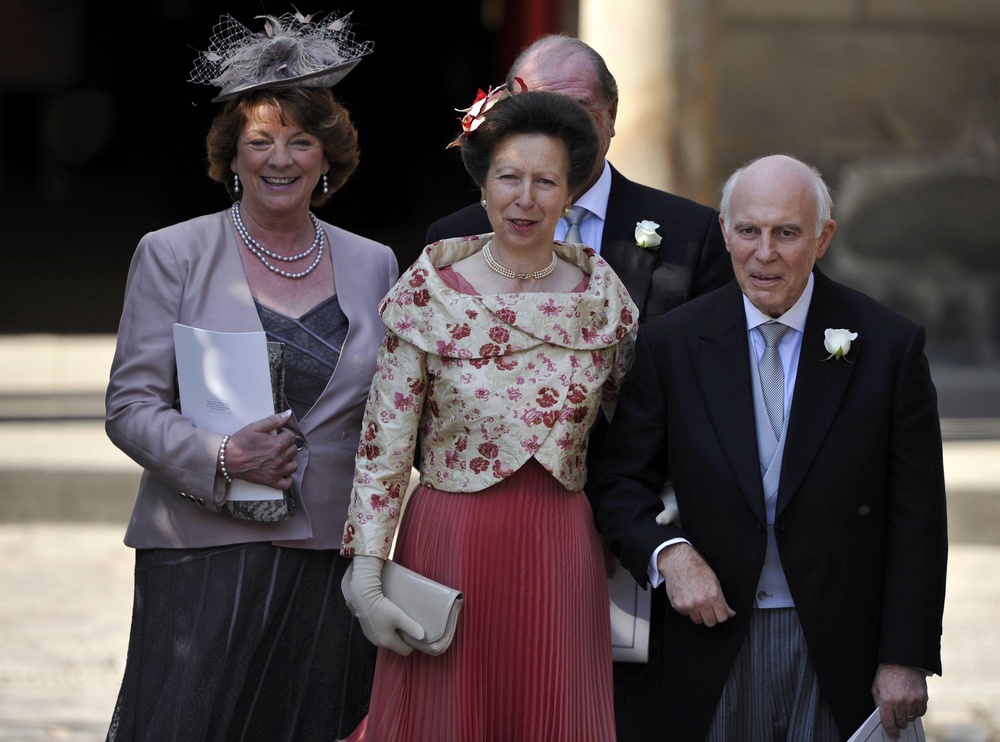 The Princess Royal, centre, with Mike Tindall’s parents Linda, left, and Philip, right, at his wedding to Zara in 2011 (Dylan Martinez/PA) (PA Archive)