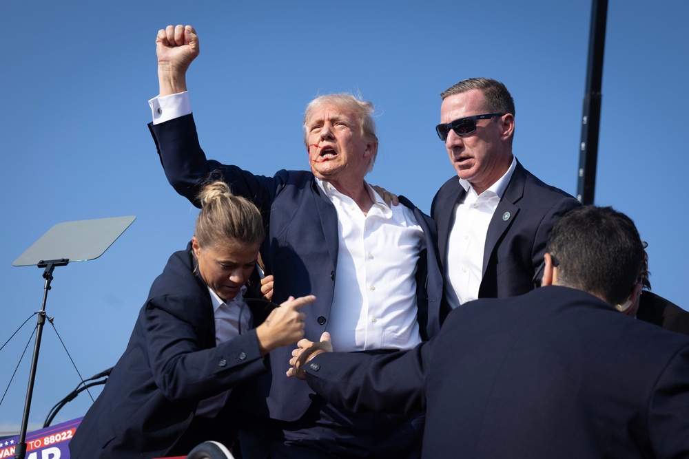 Following the shooting, Trump stood up on stage, raised his fist defiantly in the air and shouted ‘fight, fight, fight’ (Getty Images)