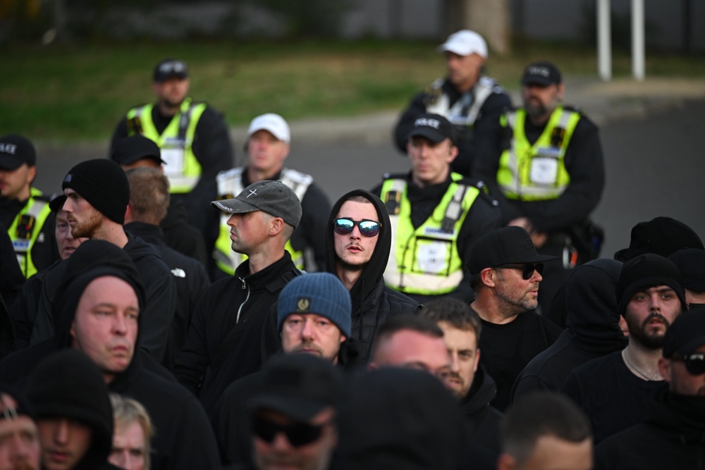 Police officers watched the crowd standing about (Getty)