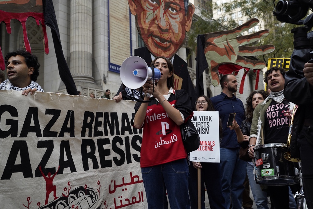 Protesters gathered outside the UN building in New York (Madison Swart/AP) (AP)