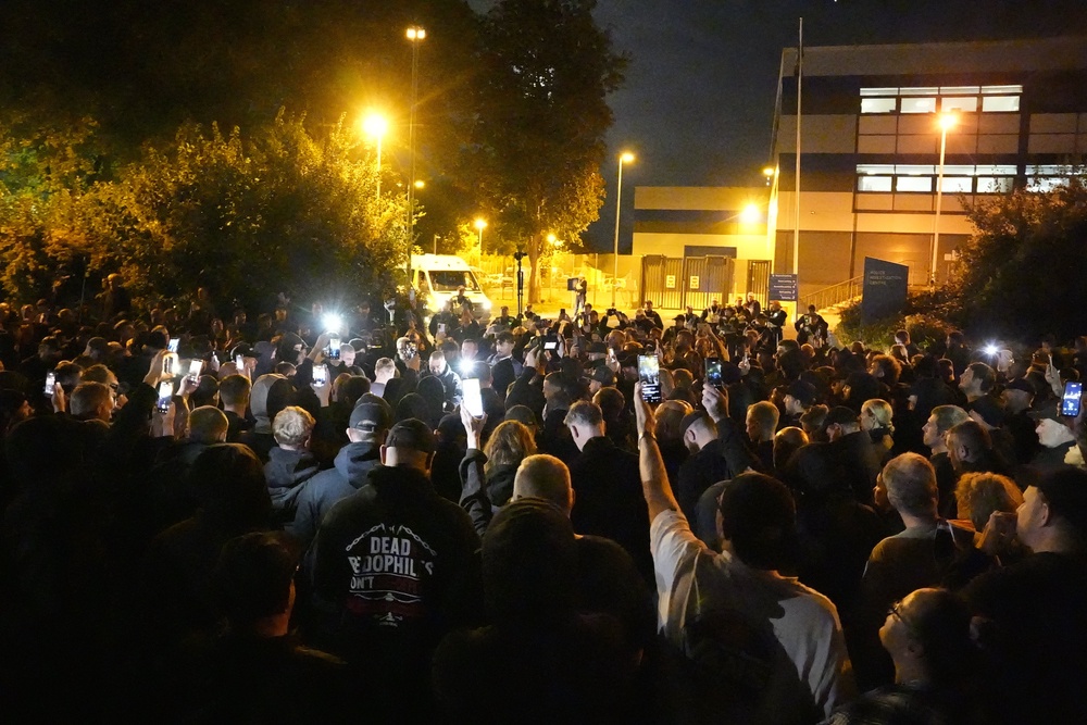 Protesters take part in a communal prayer outside the Basingstoke police investigation centre where they believed Danny Tommo was being held (PA Wire/PA Images) (PA Wire)
