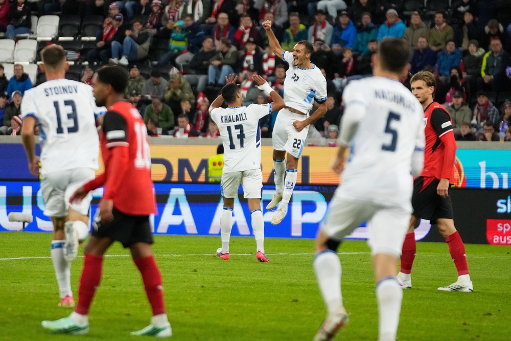 Saied Abu Farchi scored for Israel but was sent off for a gun celebration (AP)