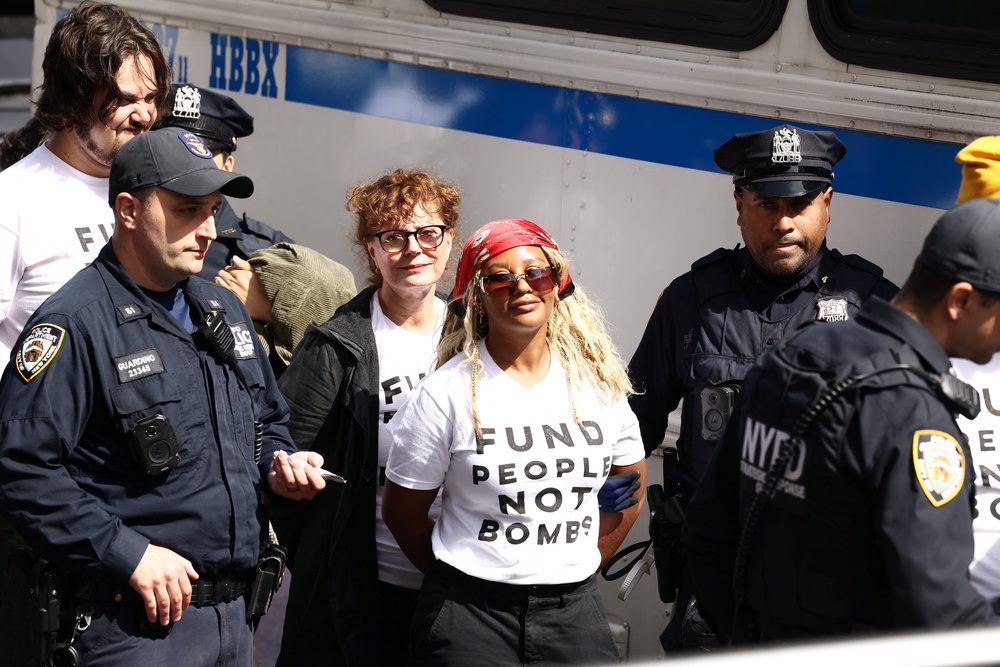 Police officers detain actor Susan Sarandon near the UN headquarters in New York (AFP/Getty)
