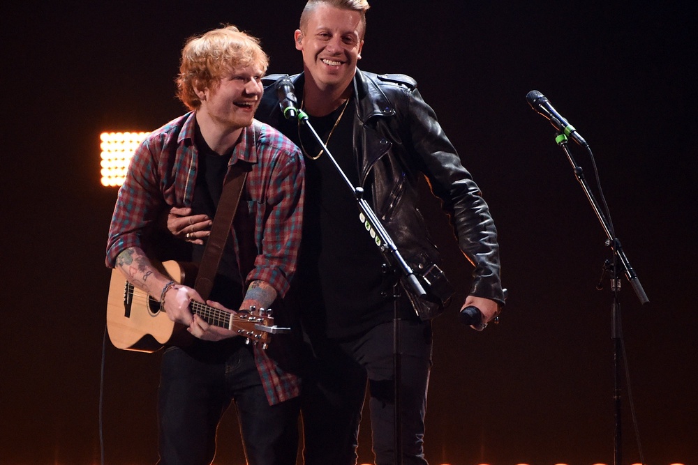 Ed Sheeran (L) and rapper Macklemore perform during the 2014 iHeartRadio Music Festival at the MGM Grand Garden Arena on September 20, 2014 (Getty)
