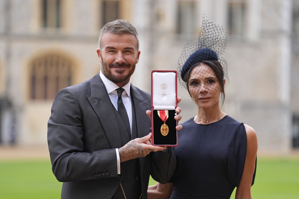 Sir David Beckham, with his wife Lady Beckham, after he was made a Knight Bachelor in 2025 (Andrew Matthews/PA) (PA Archive)