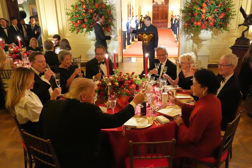 Trump dined with President Xi (seen standing), Apple’s Tim Cook (right) and SpaceX’s Elon Musk (left) (AP)