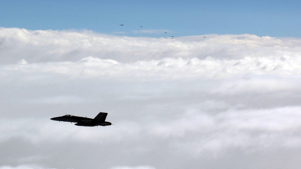 The group of Russian warplanes could be seen in the distance (Reuters)