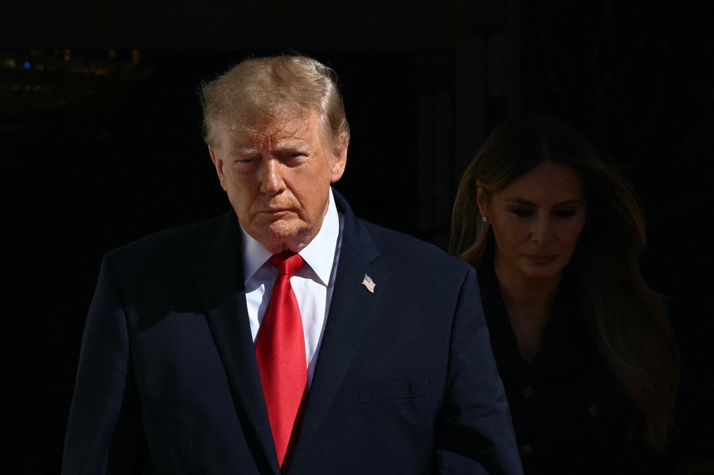 President Trump had a noticeable scowl on his face as he looked out upon the press pool while awaiting China’s Xi Jinping and his wife Peng Liyuan for tea at the White House Friday (AFP via Getty Images)