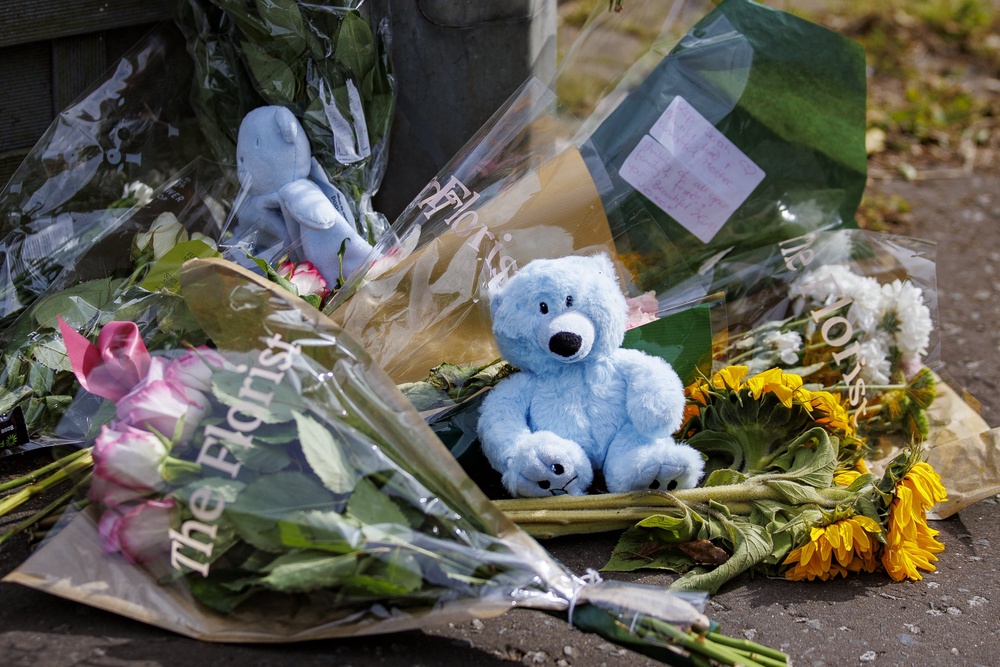 Floral tributes and teddy bears placed in Elmfield Walk area of Donaghadee, Co Down (PA) (PA Archive)