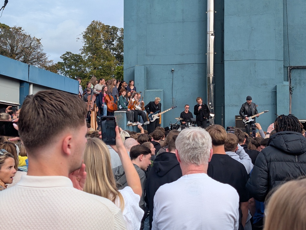 U2 performing to students from their old school (Cillian Sherlock/PA) (PA Wire)