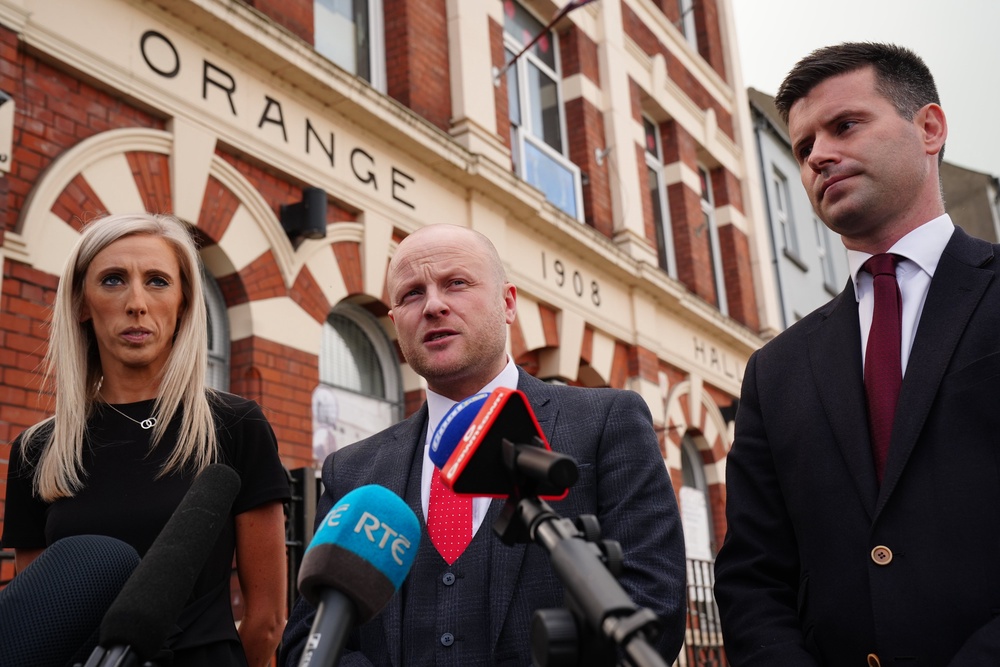 (left to right) MP Carla Lockhart, Portadown Orange District LOL 1 legal representative and loyalist activist, Jamie Bryson, and Jonathan Buckley (Brian Lawless/PA) (PA Wire)
