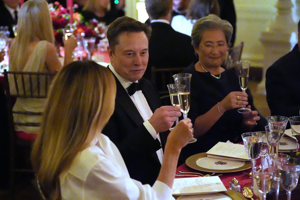 The combined net worth of powerful tech figures and leading figures in the AI arms race who attended the dinner, including Elon Musk, was north of $2 trillion (AP)