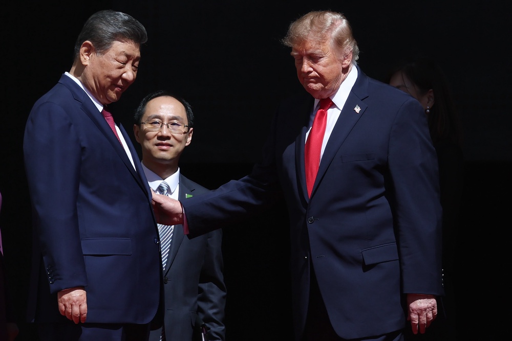 President Donald Trump (R) and President of China Xi Jinping (L) speak via an interpreter as they depart following a tour of the National Archives Museum on September 25, 2026 in Washington, DC (Getty)