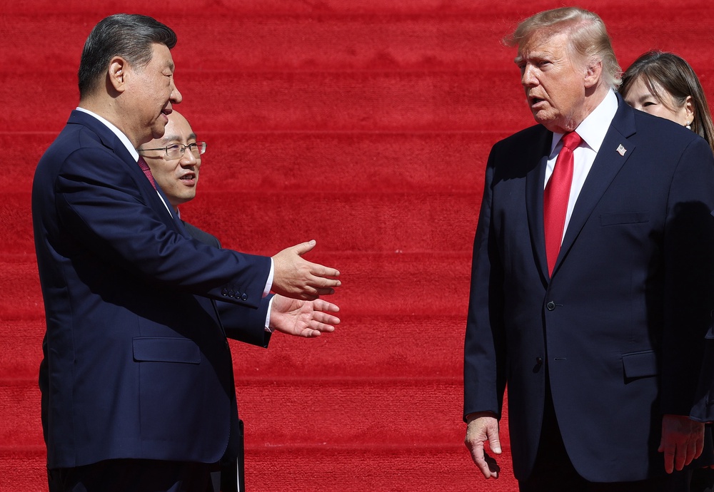 President Donald Trump (R) and President of China Xi Jinping (L) speak as they depart following a tour of the National Archives Museum on September 25, 2026 in Washington, DC (Getty)
