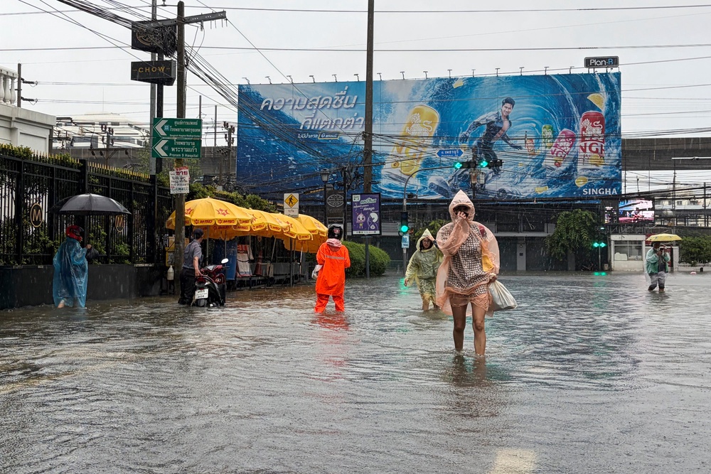 People wade through floodwaters after heavy rain in Bangkok, Thailand Saturday, Sept. 26, 2026. (AP)
