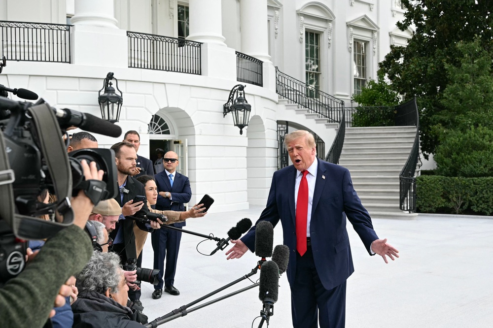 Trump speaks to members of the press before boarding Marine One as he departs from the South Lawn of the White House in Washington, DC, on September 26, 2026. US President Donald Trump is heading to Knoxville, Tennessee to attend the Tennessee/Texas college football game (AFP via Getty Images)