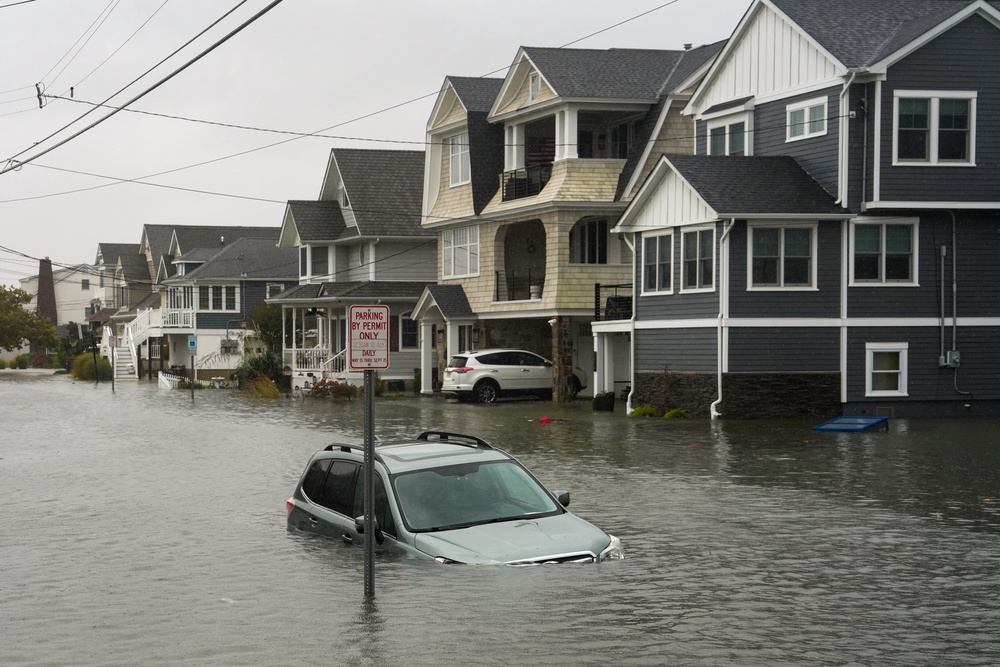 A car submerged in water on a flooded road in Point Pleasant (Getty Images)