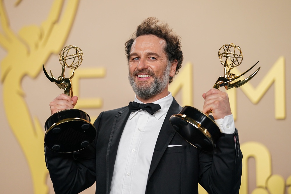 Matthew Rhys with his Emmy awards for best lead actor in a limited series and best lead comedy actor (Richard Shotwell/PA) (AP)