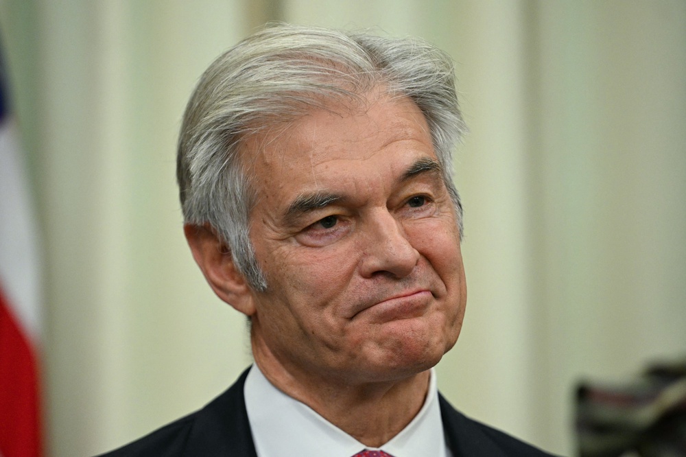 Medicare and Medicaid Administrator Mehmet Oz listens to President Donald Trump speak in the Oval Office (AFP via Getty Images)