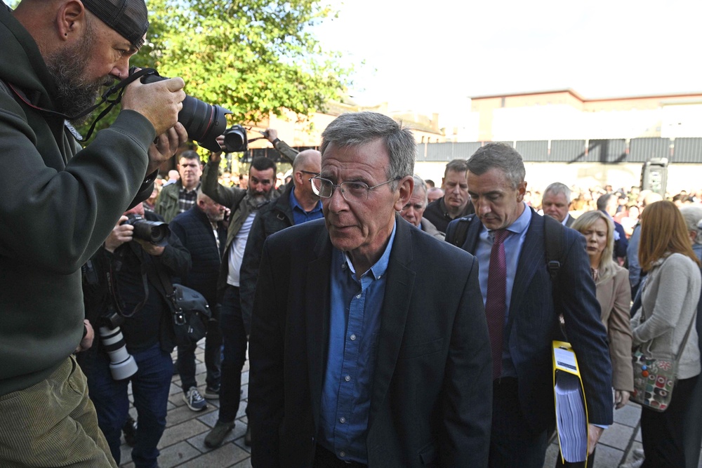 Breandán Mac Cionnaith of Garvaghy Road Residents Coalition addressed supporters outside the court (Mark Marlow/PA) (PA Wire)