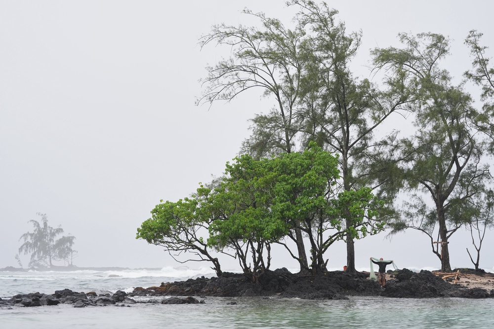 Kawika Ige fishes as Hurricane Nolo sits nearby Friday, Sept. 25, 2026, in Hilo (Copyright 2026 The Associated Press. All rights reserved)
