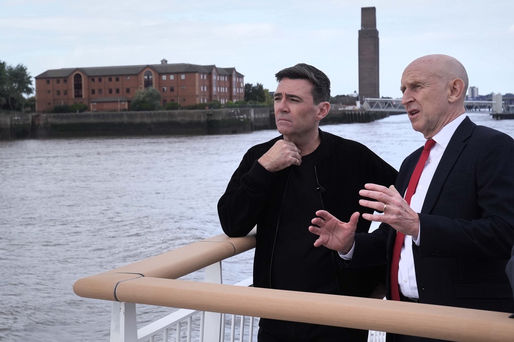 Andy Burnham (left) and John Healey on the new Royal Daffodil Ferry (PA)