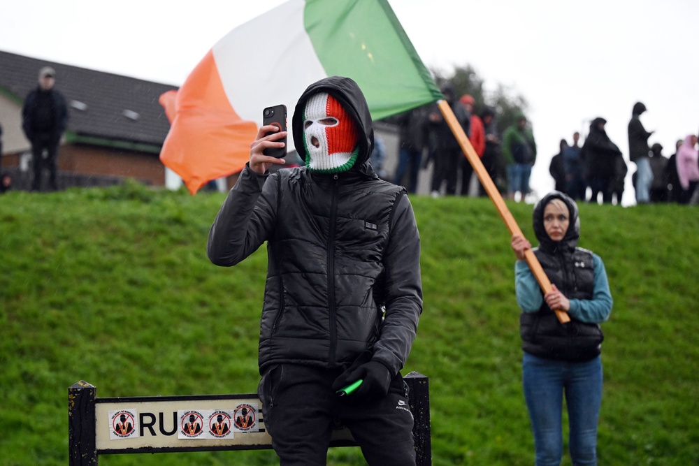 A protester in an Irish flag balaclava (Getty)