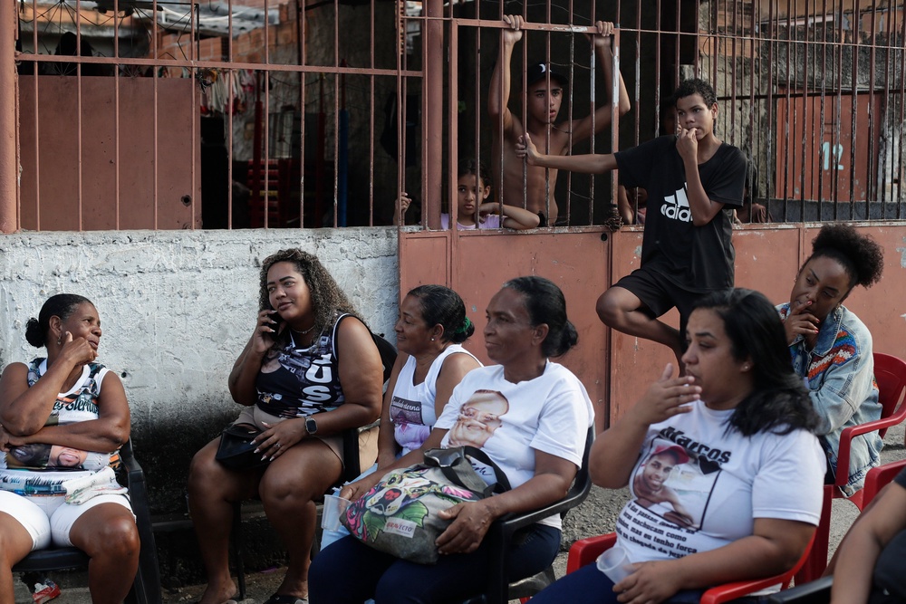 Mothers whose sons were killed by police attend a tribute event in the Morro da Crianca favela in Rio de Janeiro, Saturday, Sept. 19, 2026 (AP Photo/Bruna Prado)