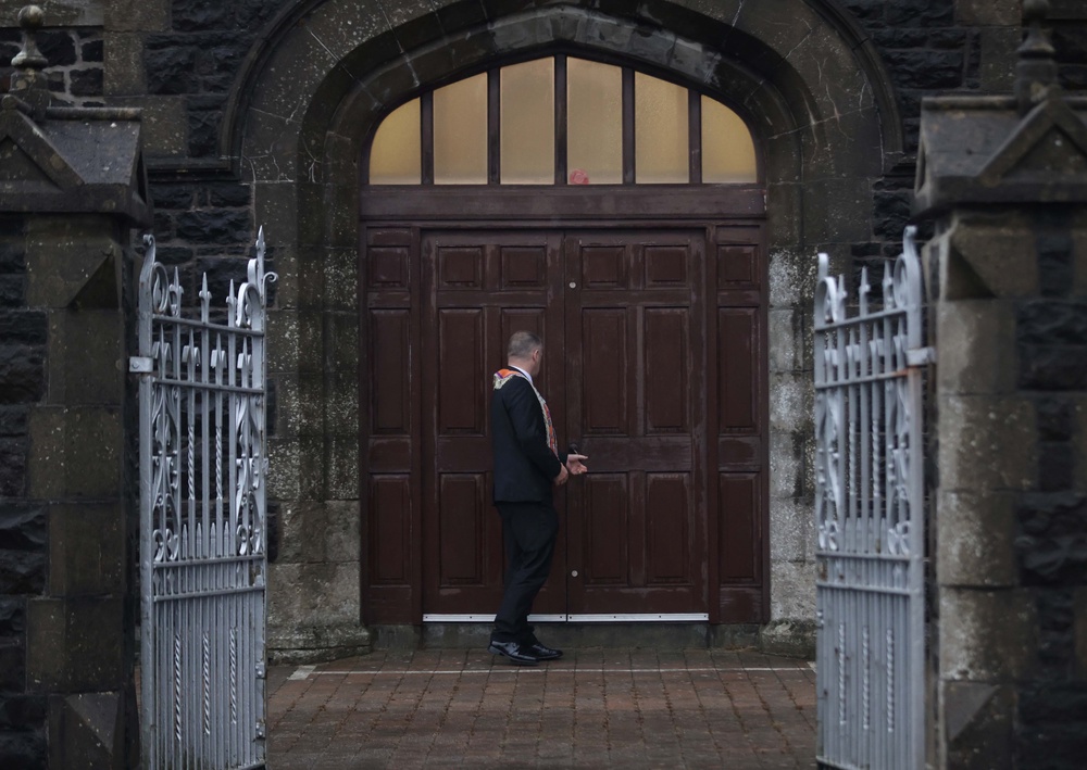 A member of the Orange Order outside Drumcree Parochial Hall in Portadown (Peter Morrison/PA) (PA Wire)