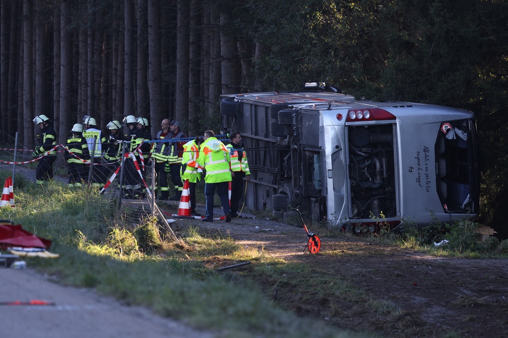 A tourist bus veered off a highway in Buchloe, Germany, and overturned on Sunday on the way to Oktoberfest (Karl-Josef Hildenbrand/dpa via AP)