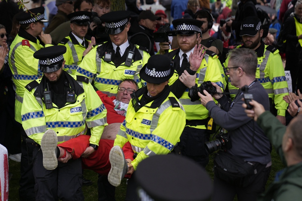 A demonstrator is removed from the protest (PA)