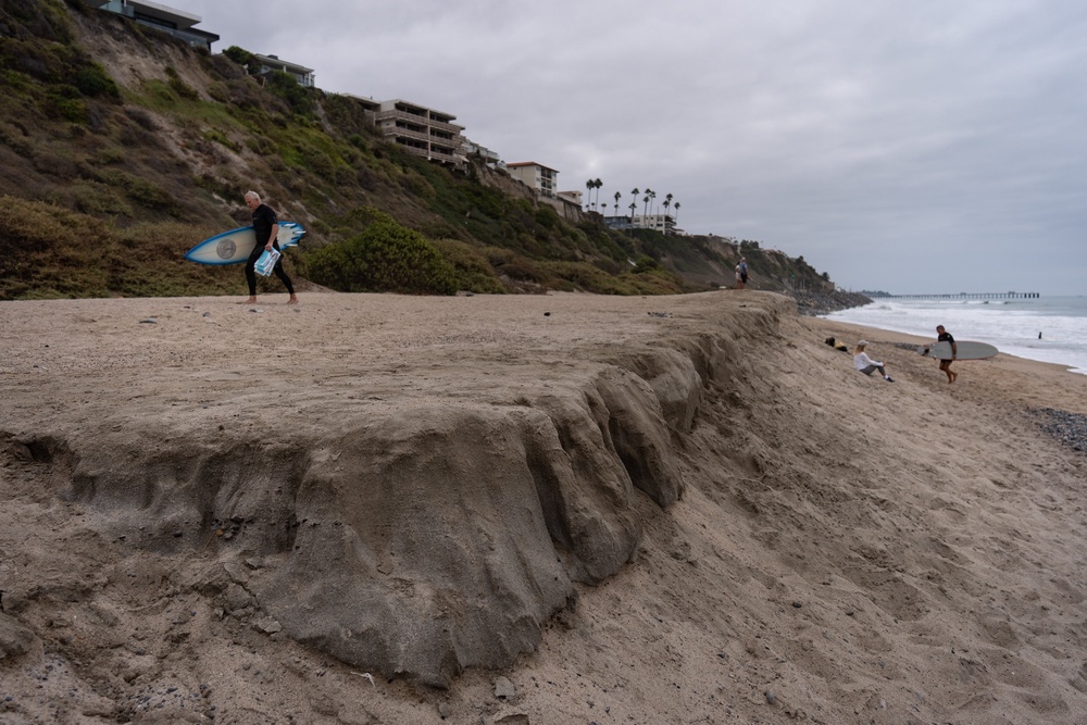 Surfers walk along North Beach in San Clemente, Calif., Friday, Sept. 18, 2026 (AP)