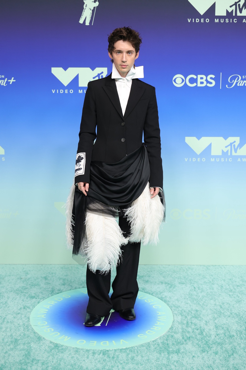 I’m confused by this Troye Sivan look. It’s giving Victorian child at the top and 1920s flapper dancer from the waist down... (Getty Images)