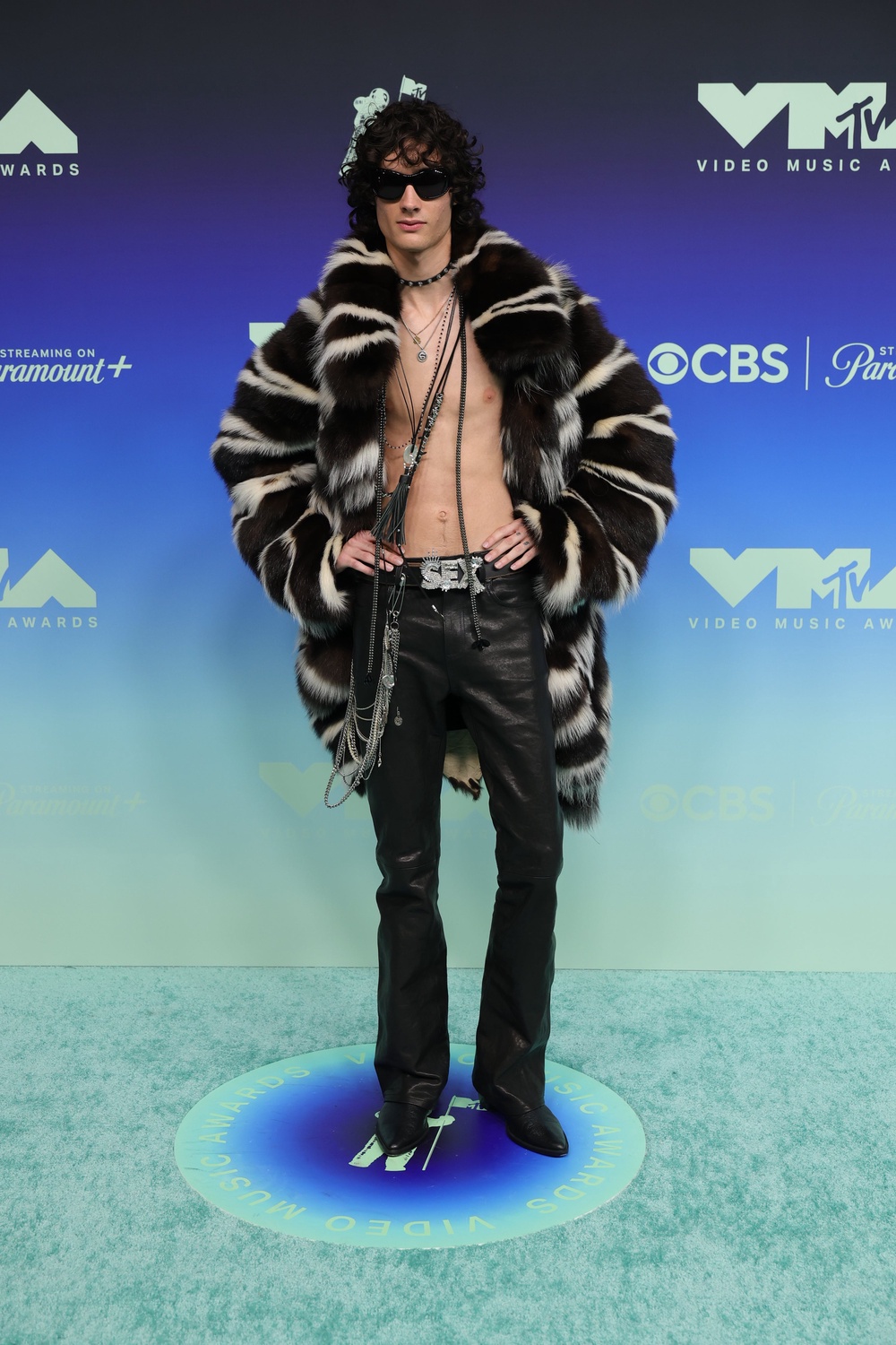 Musician Sombr appeared topless in a pair of leather pants and a fur coat, accessorized with a belt that says ‘sex.’ It’s a choice (Getty Images)
