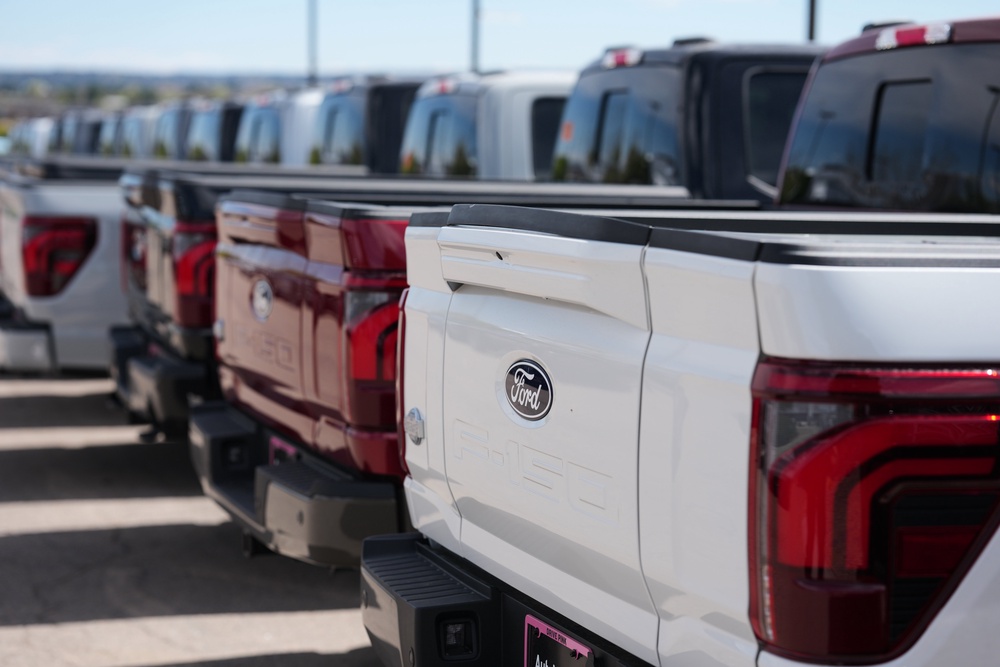 Unsold 2026 F-150 pickup trucks sit in a long line outside a Ford dealership on April 12, 2026, in Centennial, Colorado (Copyright 2026 The Associated Press. All rights reserved.)