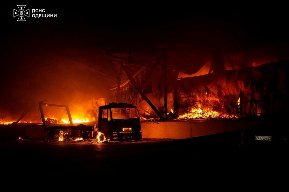 A truck burns at the site of a sorting terminal of the Nova Post delivery company which was hit by a Russian drone strike (Reuters)