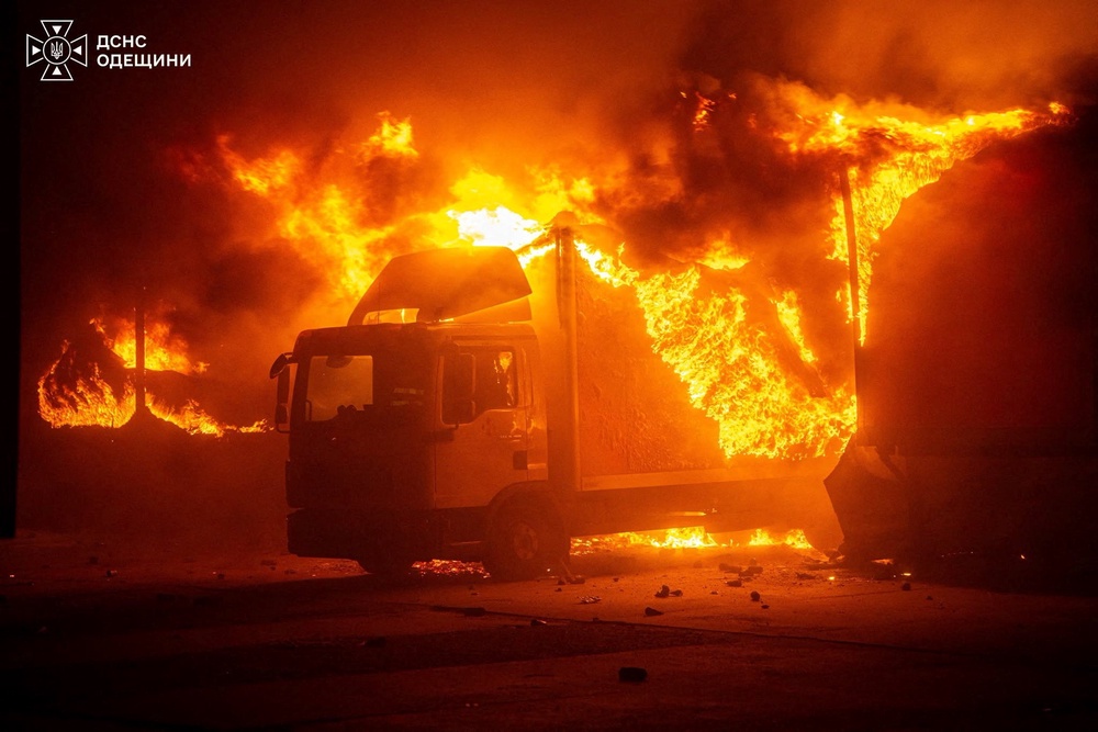 A truck burns at the site of a sorting terminal of the Nova Post delivery company which was hit by a Russian drone strike (Reuters)