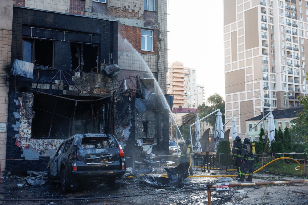 Firefighters work at the site of a cafe which was hit by a Russian drone strike, amid Russia's attack on Ukraine, in Kyiv, Ukraine 28 September 2026 (Reuters)