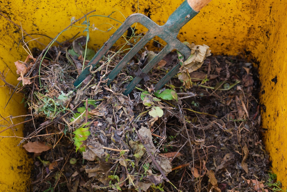 Fill your compost bin two-thirds full to give you room to turn it easily with a fork (Alamy/PA)