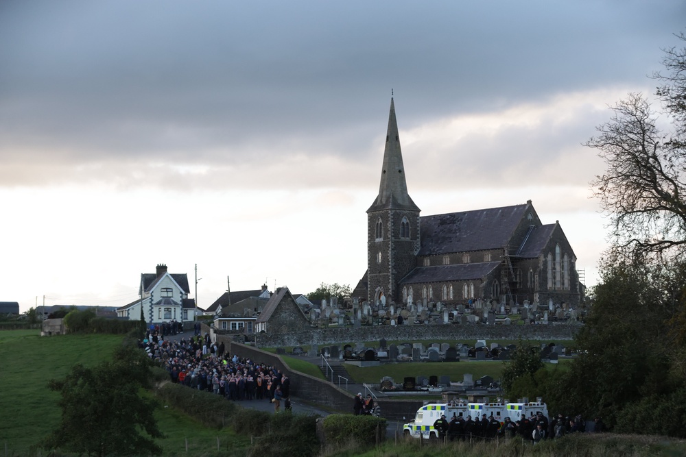 Loyalist supporters face the police outside Drumcree Church (Peter Morrison/PA) (PA Wire)