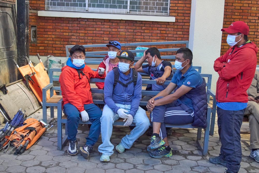 Family members and friends of Nepali climbers gather as the bodies of Nepali climbers recovered after an avalanche on Mount Himlung lie at the morgue of a hospital in Kathmandu, Nepal (AP)