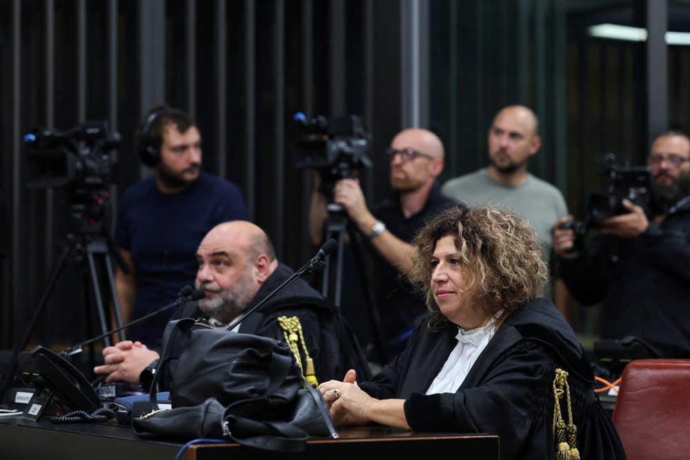 Lawyers for the Egyptian security service members look on (Reuters)