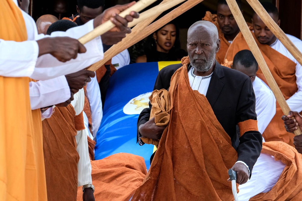 Charles Kayondo Kamurasi, head of the Babiito royal clan, walks out of Karuziika Royal Palace, where the body of the late Omukama, Oyo Nyimba Kabamba Iguru Rukidi IV of Toro lies in state ahead of the burial at the Karambi Royal Tombs on September 12, 2026 in Fort Portal, Uganda (Getty)