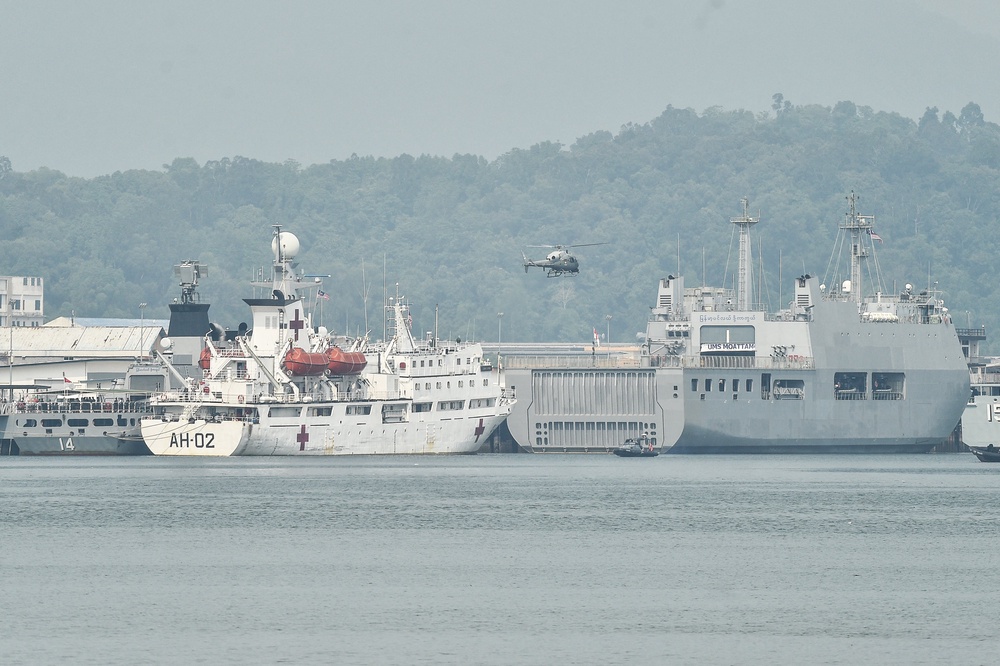 A Malaysian navy helicopter patrols near ships waiting to transport Myanmar nationals at Lumut on the outskirts of Kuala Lumpur (AFP/Getty)
