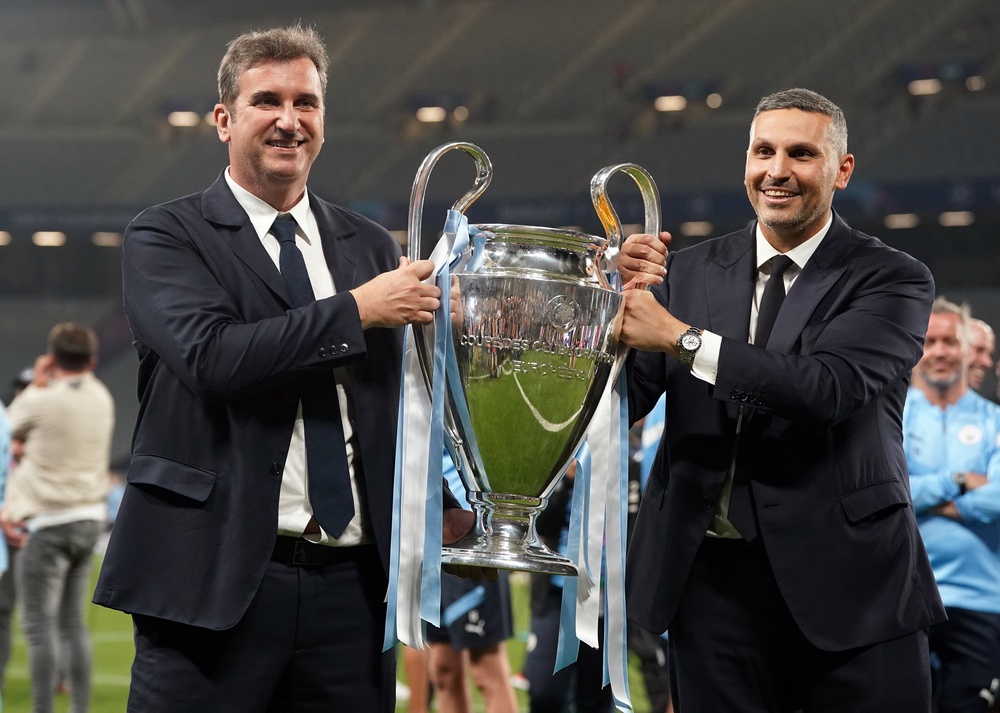 Manchester City Chairman Khaldoon Al Mubarak and CEO Ferran Soriano with the UEFA Champions League Trophy (PA)