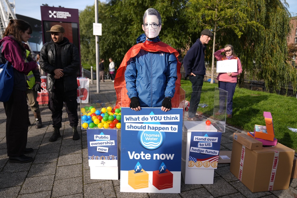 A protester wearing an Andy Burnham face mask during an anti-Thames Water demonstration during the Labour Party Conference (Peter Byrne/PA) (PA Wire)