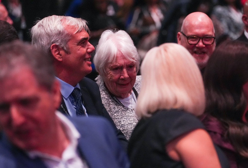 Eileen Burnham (centre) and John Burnham (left), mother and brother of Prime Minister Andy Burnham were in the audience for his first speech as Labour leader (Annabel Lee-Ellis/PA) (PA Wire)