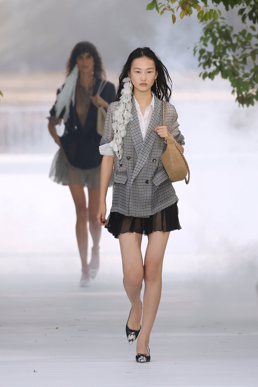 Sheer blazers over skirts were reminiscient of Dior’s 1950s silhouettes (Thomas Padilla/AP) (AP)