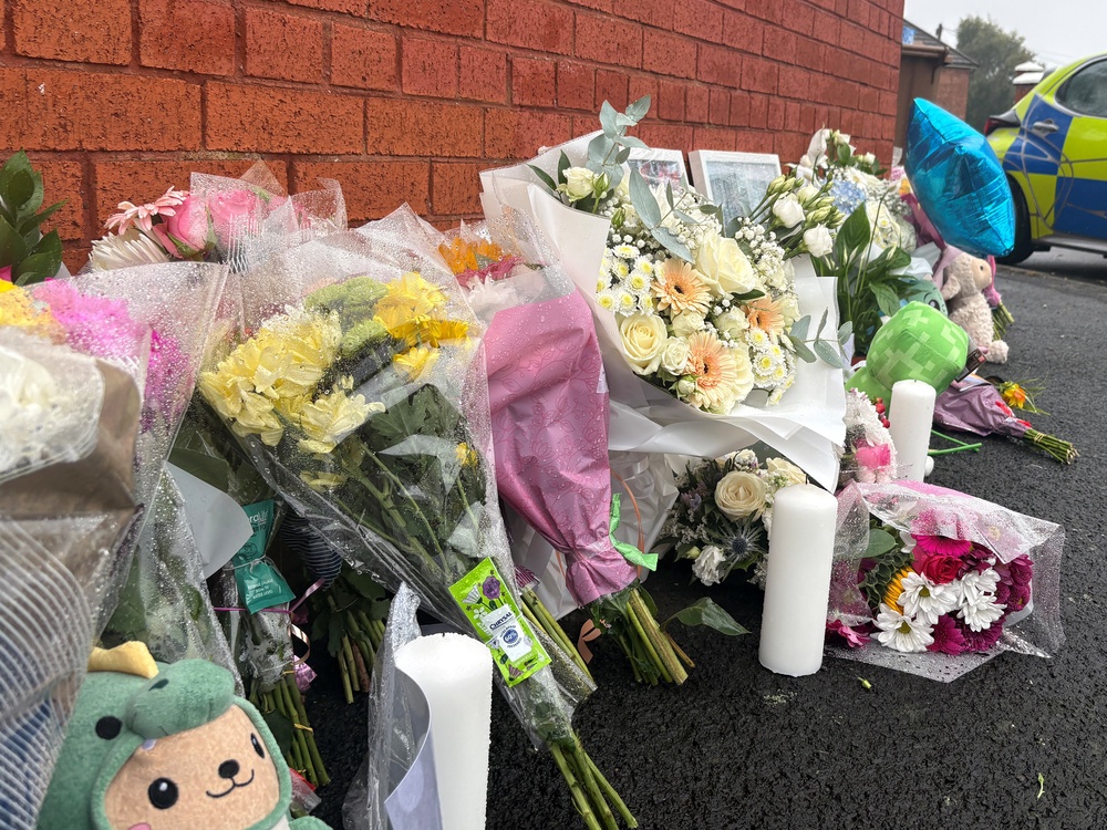 Floral tributes near to the scene of the fire in Stone Square in Bootle, Sefton (Eleanor Barlow/PA) (PA Wire)